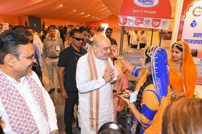 Women giving a traditional welcome to Union Cooperation Minister Amit Shah at the Saras stall at Sahakar Utsav.